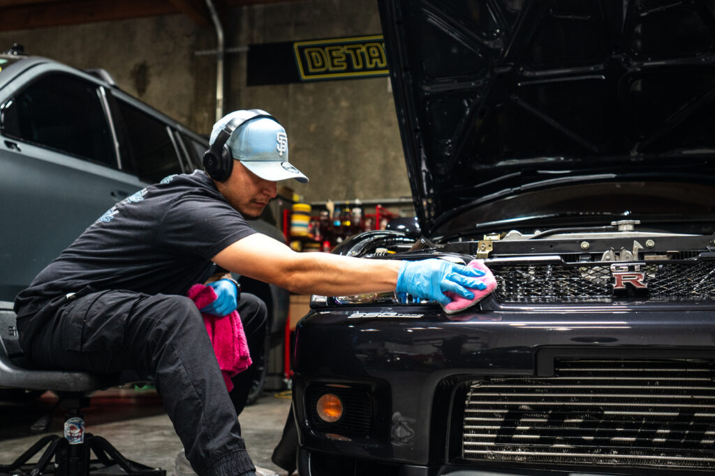 A technician finalizes the install of Paint Protection Film on a heavily modified Nissan Skyline at SS Customs in Menlo Park.