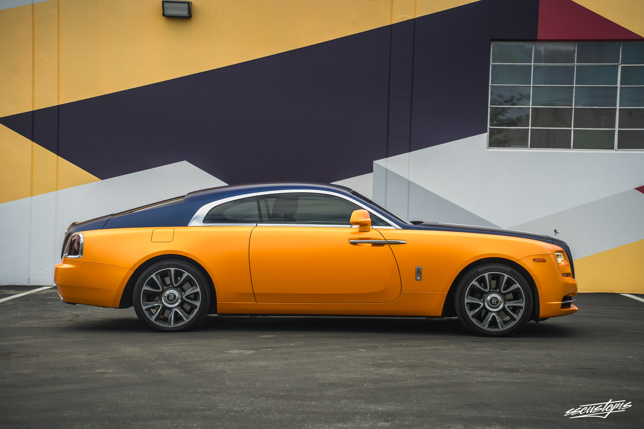 Exotic Car: A stunning rare Rolls Royce Wrapped in KPMF Sinister blue and PWF Matte Sunrise Orange. Coated with ceramic pro